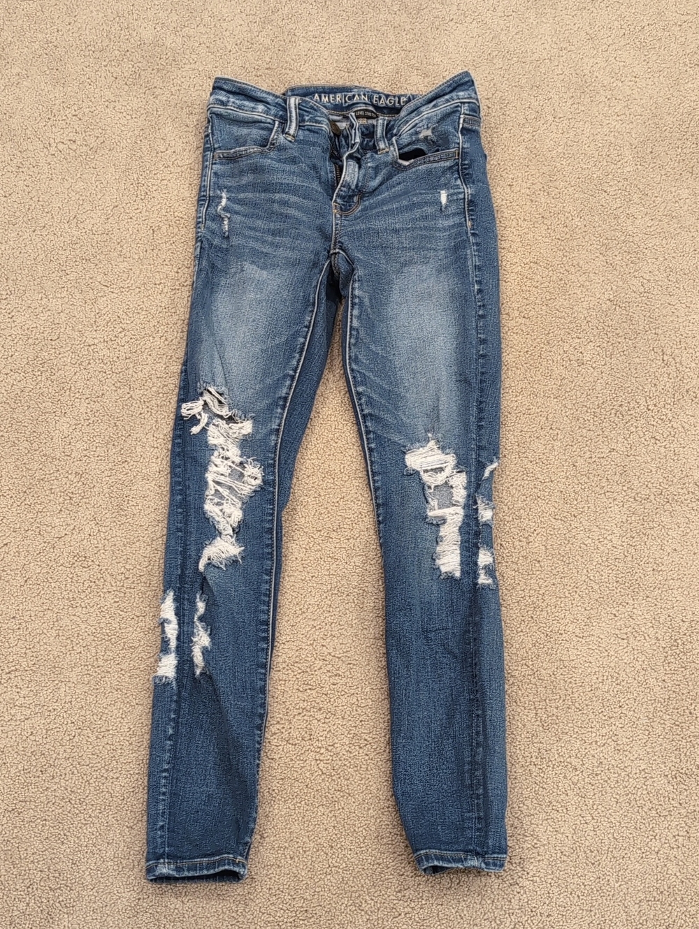 American Eagle Outfitters Distressed Skinny Jeans in Medium Blue